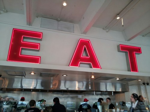 Eating at the EAT sign!