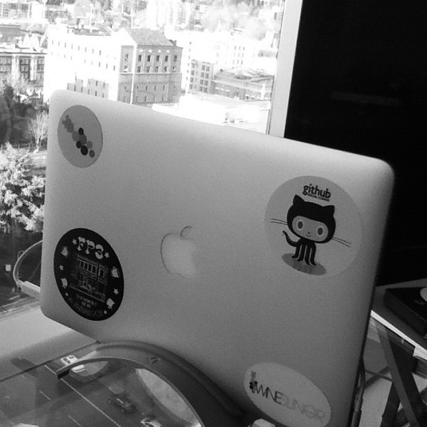 2011 Mac Book Air, settled into it's workspace cradle.