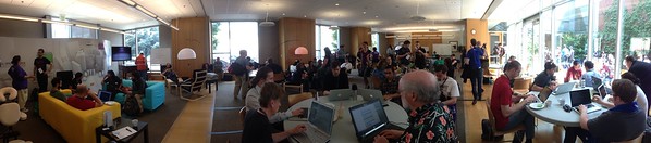 A wide angle of activity ala the Hacker Lounge. Click for full size image.