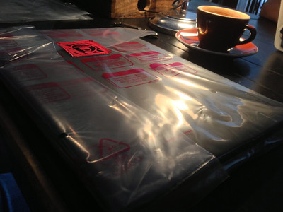In the package, laptop sitting on the table at Ace Hotel's Stumptown Coffee.